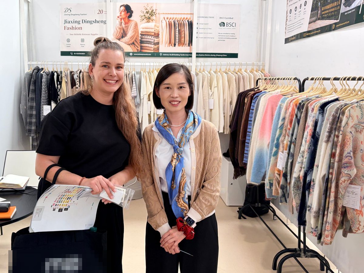 Marcia Lee meeting a buyer at the Knitwear World stand in Paris