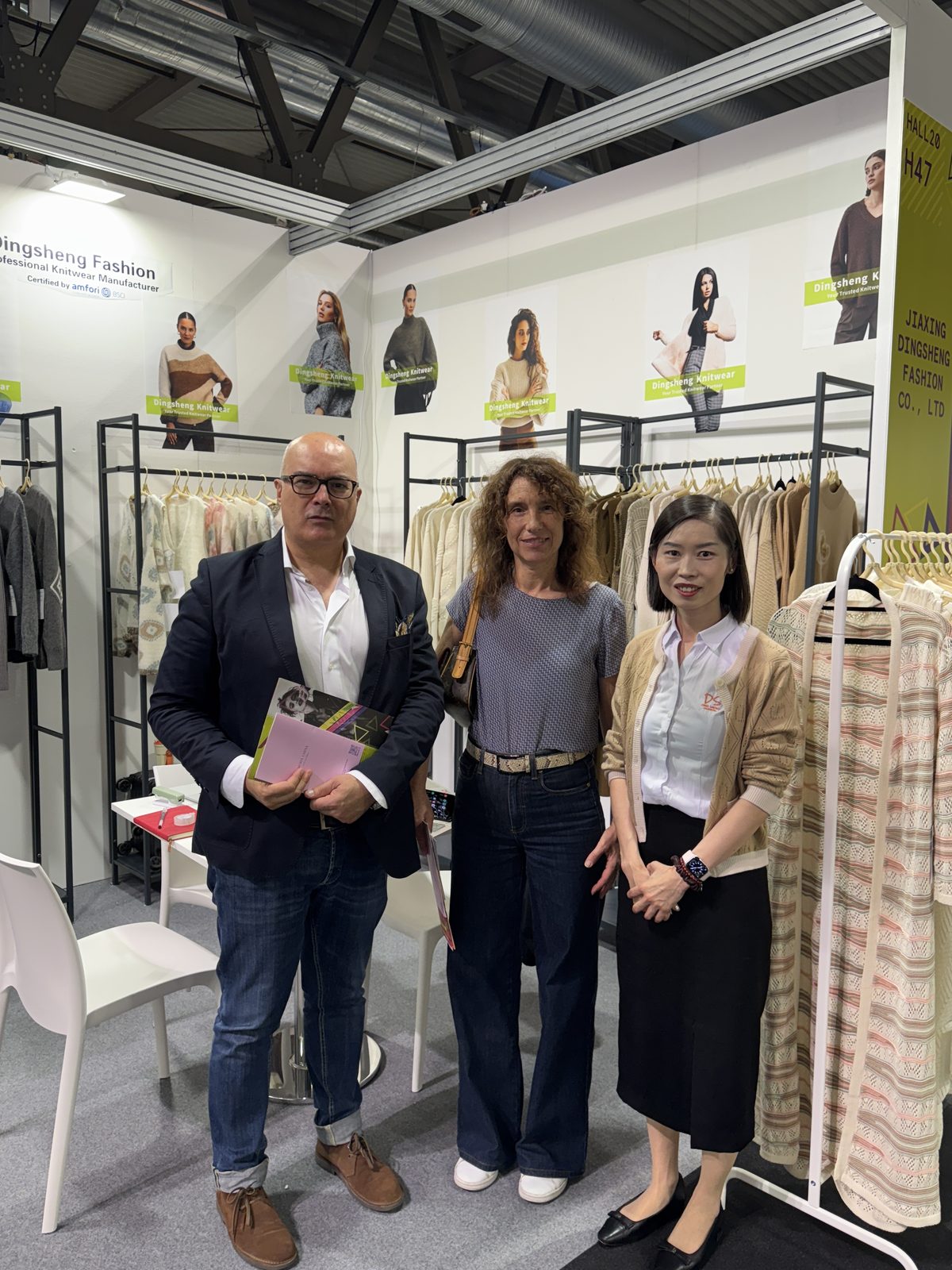 Marcia Lee with two buyers at a trade fair in Europe