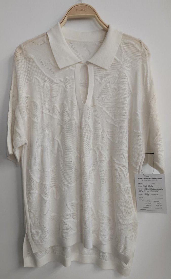 White textured short-sleeve knit polo, style DS26-07042, from the Knitwear World sample collection