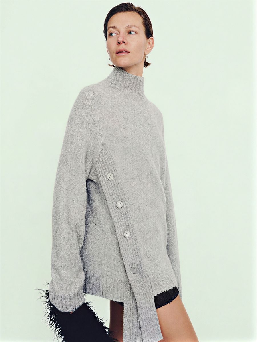 Women's grey asymmetric turtleneck sweater, made by Knitwear World